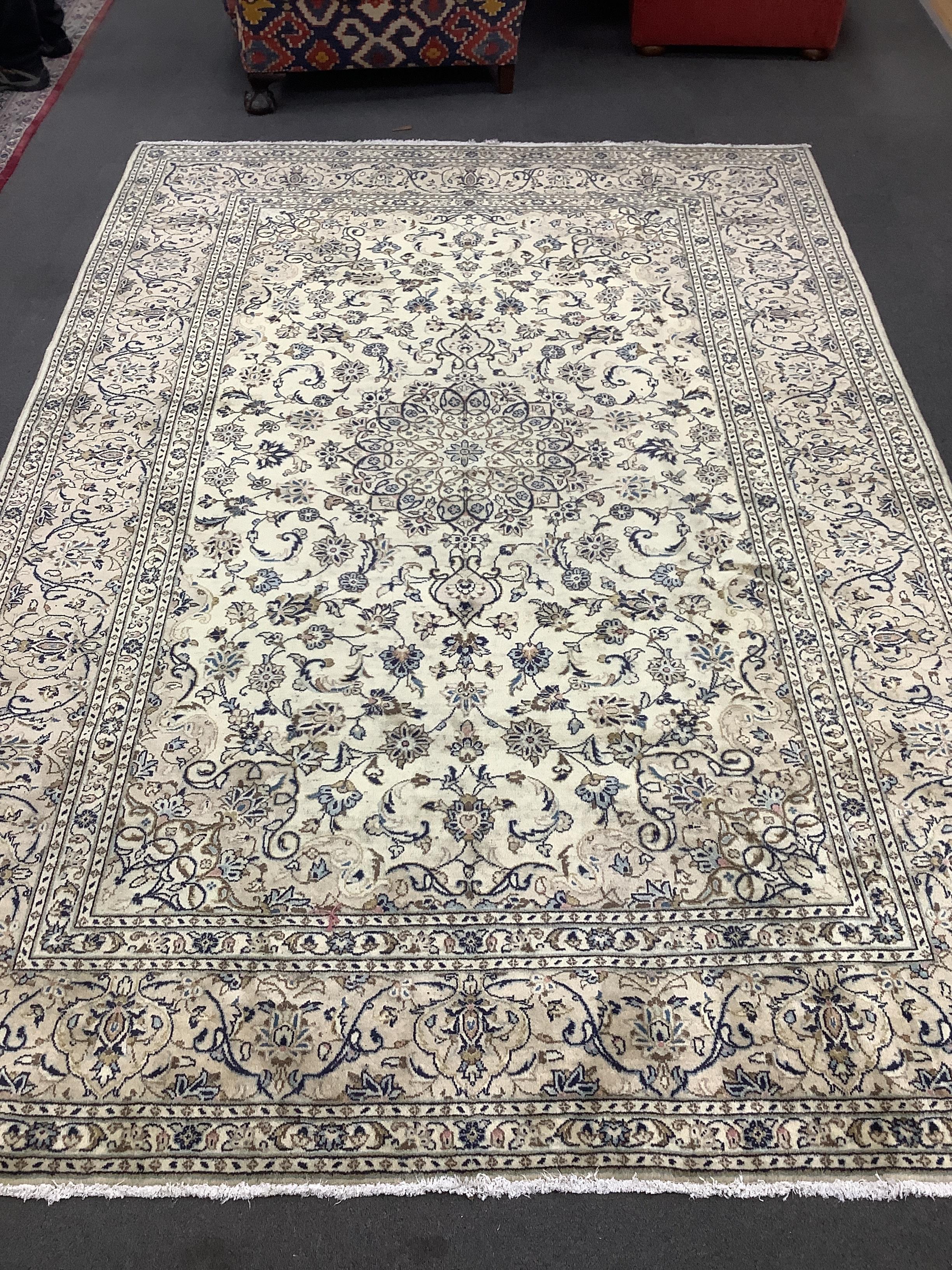 A Kashan ivory ground carpet, 284 x 195cm